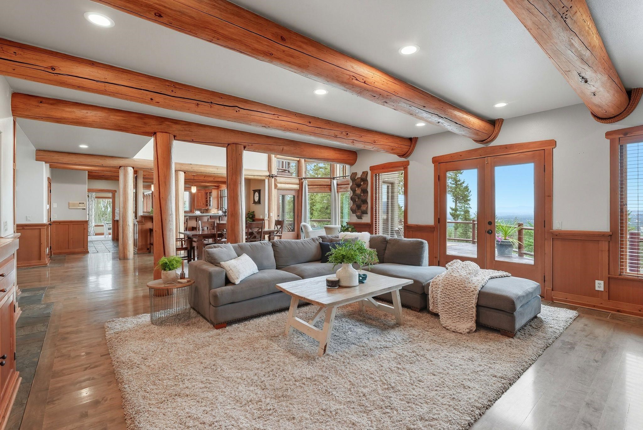 Before — Stage this living room in a warm farmhouse style: oversized